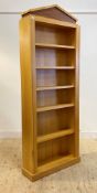 A quality bespoke satin birch veneered floor standing open bookcase, the arched top over five