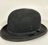 A 1920s / 30s gentleman's bowler hat, made of fine felt with satin lined interior, complete with