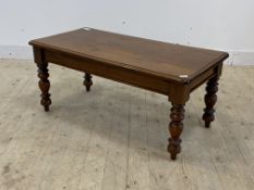 A Victorian style mahogany coffee table, the rectangular top raised on turned supports H48cm, W55cm,