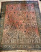 A large Persian carpet, hand knotted, the red field decorated with stylised trees and foliate