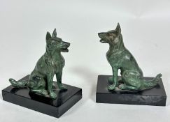 A pair of spelter patinated bronze seated German Shepherd bookends on black marble bases, (h 13cm