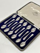 A set of twelve Sheffield silver Old English pattern coffee spoons complete with original fitted