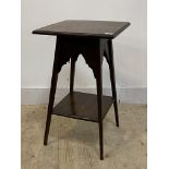 An Edwardian stained mahogany lamp table, the moulded top raised on splayed square tapered