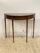A Georgian figured mahogany demi lune console table, standing on square tapered supports, H81cm,