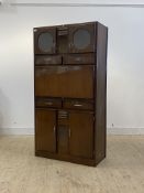 A mid century kitchen larder cabinet, circa 1950's, fitted with a combination of drawers and