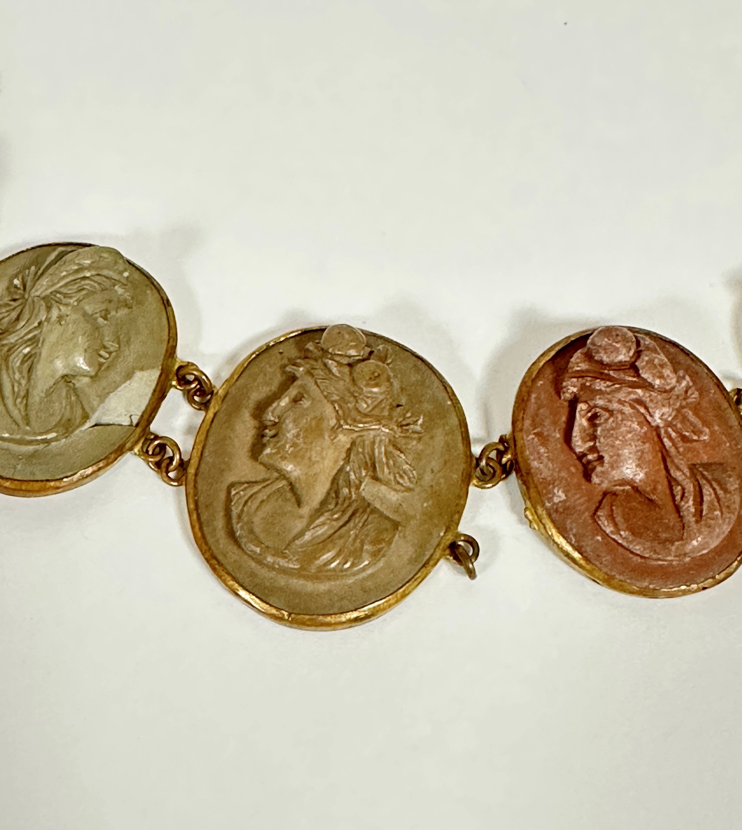 A 19thc gilt metal mounted graduated oval lava cameo bracelet, one panel missing, damage to links - Image 3 of 5