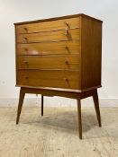 Alfred Cox for AC furniture, a mid century teak chest, fitted with five graduated drawers, raised on