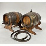 A pair of oak coopered brass port barrels, (including stands h: 27cm x 27cm, bases 26cm) one with