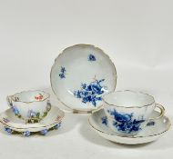 A pair of Meissen porcelain saucers decorated with blue and gilt floral sprays, with butterfly,