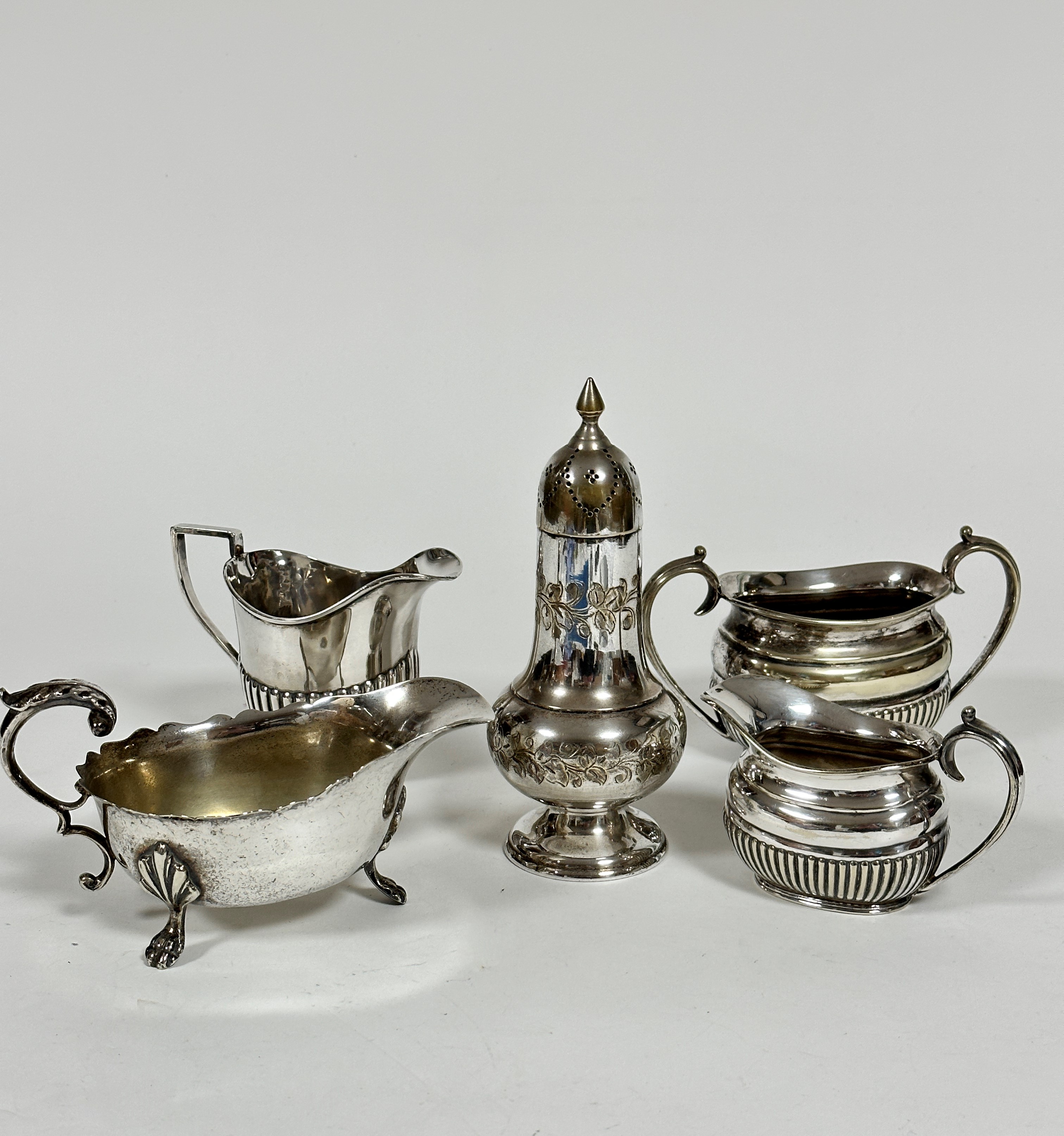 An Epns half lobed oval two piece part tea set including sugar basin and cream ewer (7cm x 10cm), an