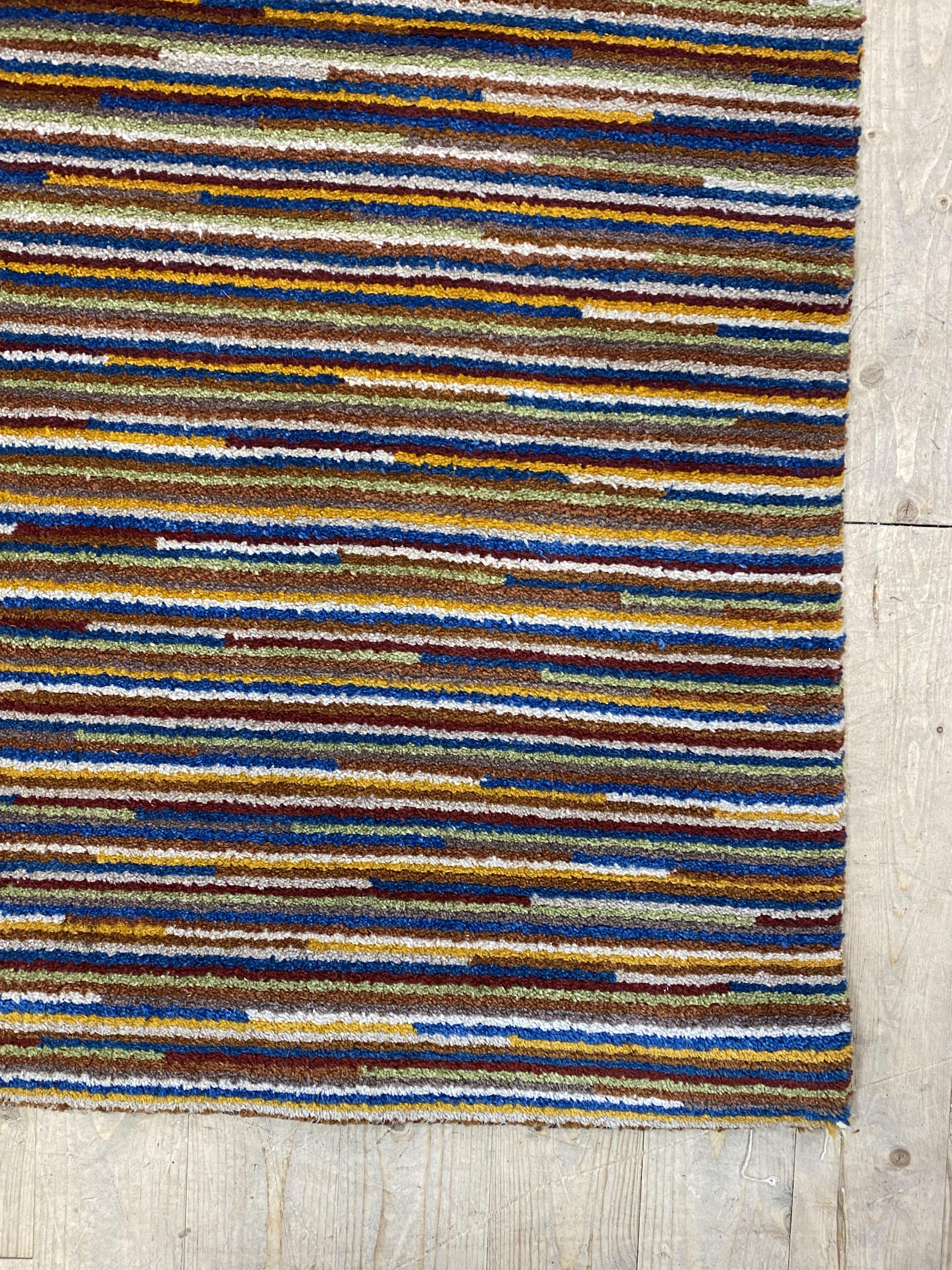 A contemporary wool pile rug of all over polychromatic lineal design, 202cm x 296cm - Image 2 of 2