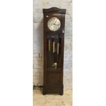 A 1930's oak cased Westminster chiming longcase clock, the silvered dial with Arabic chapter ring,