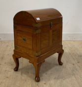 A reproduction brass inlaid hardwood dome-topped chest, the top opening to an interior with lift out