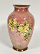 A Royal Winton baluster pink lustre vase with craquelure glaze with yellow rose style decoration,