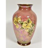 A Royal Winton baluster pink lustre vase with craquelure glaze with yellow rose style decoration,