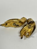 A pair of bronze cast Deity gilded hands with jewelled glass inner palms, (15cm x 5.5cm)