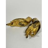 A pair of bronze cast Deity gilded hands with jewelled glass inner palms, (15cm x 5.5cm)