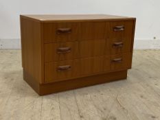 G-Plan, a mid century teak low chest, fitted with three drawers, raised on a plinth base, H54cm,