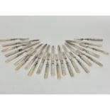 Twelve pairs of mother of pearl handled Epns engraved fruit knives and forks, (L: 18.5c)