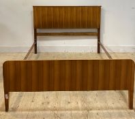 Alfred Cox for AC furniture, a mid century teak 4'6" double bed, complete with side irons, H101cm,