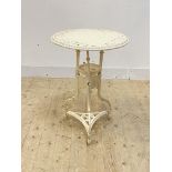 A 19th century white painted cast iron garden table, the circular floral cast top over under tier,