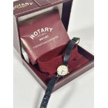 A Rotary 9ct gold lady's wrist watch with white enamelled dial and baton hour markers, on black