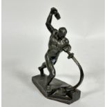 A cast metal figure in the Wiener Werkstatte style of male with raised hammer and sword, on stylised