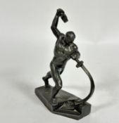 A cast metal figure in the Wiener Werkstatte style of male with raised hammer and sword, on stylised