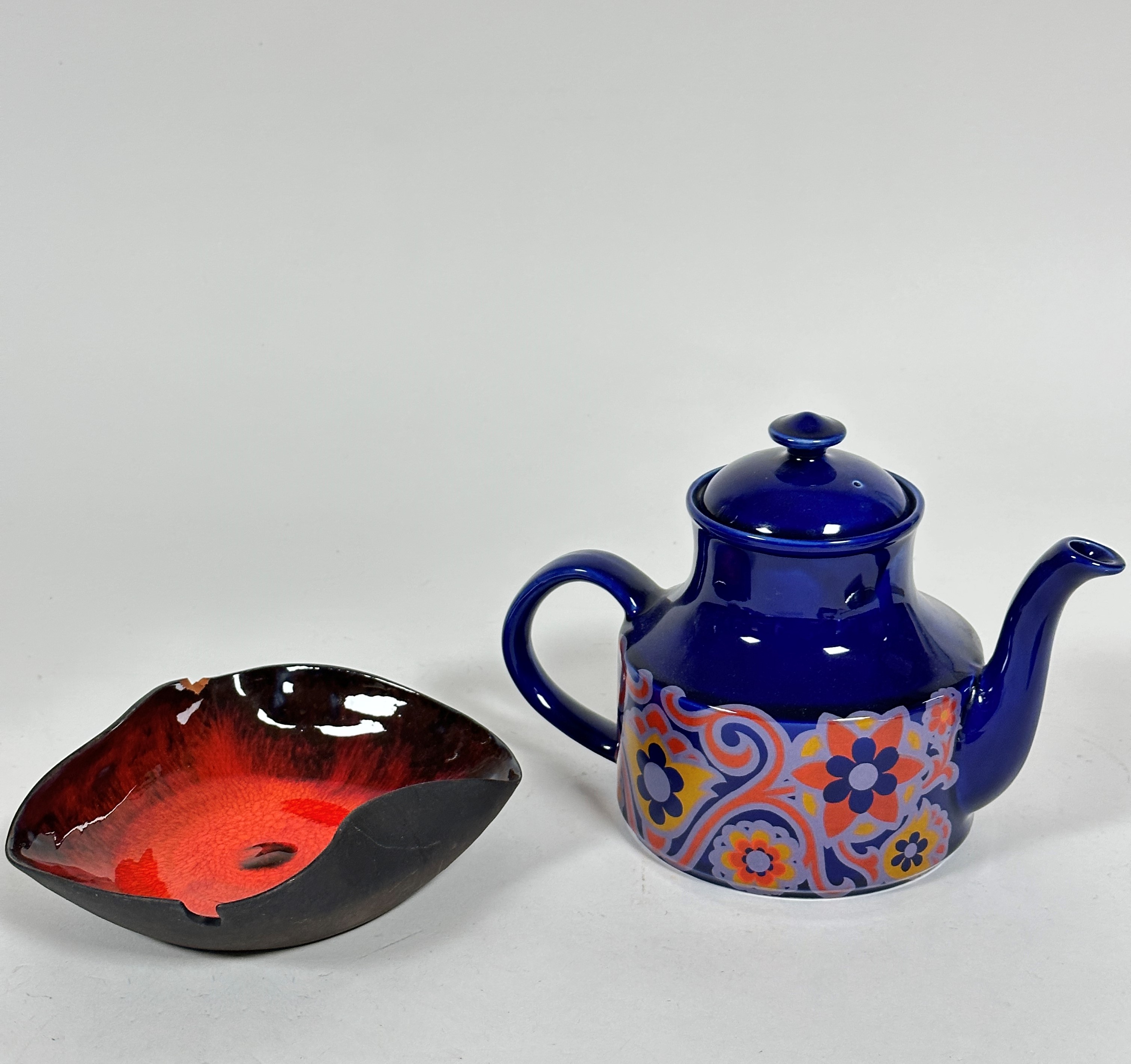 A mid century blue glazed and transfer printed stylised lotus leaf and flower designed teapot (