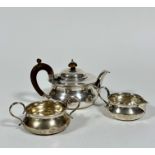 A Birmingham silver three piece morning tea service, the teapot of squat form, the treen knop and