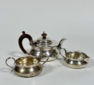 A Birmingham silver three piece morning tea service, the teapot of squat form, the treen knop and