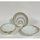 A pair of 19thc Continental china scalloped shaped serving dishes with gilt decoration, (h 6cm x
