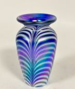 An Arts and Crafts art glass tapered cylinder vase with feathered white and blue iridescent panelled