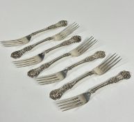 A set of seven Victorian Glasgow 1868 silver fiddle and shell pattern dessert forks with engraved