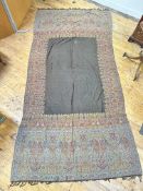 A 19thc machine made paisley shawl, the centre rectangular panel enclosed within a boteh and lotus