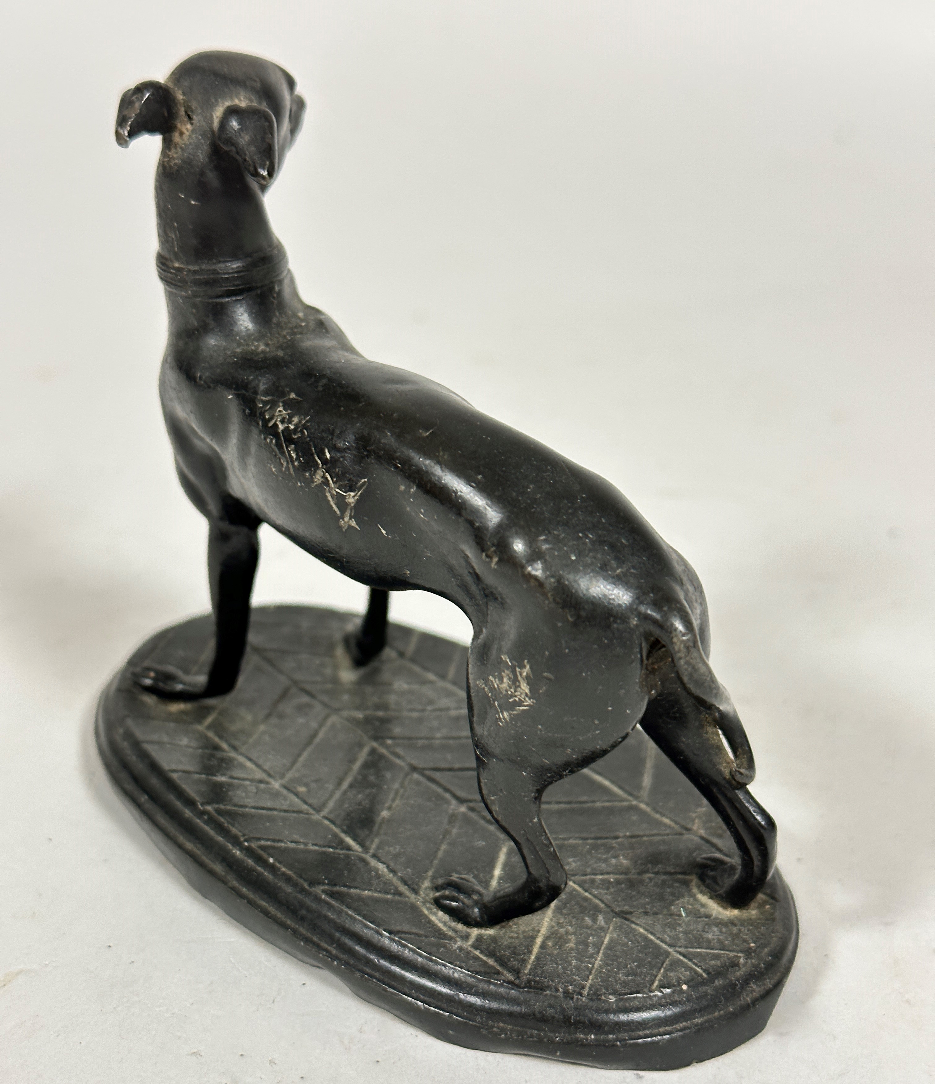 A spelter model of an Italian greyhound, raised on oval cast base, unsigned, (12cm x 13cm x 7cm) - Image 2 of 3