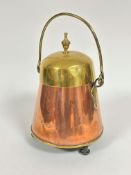 A Dutch style brass tapered cylinder coal bucket with loop handle to top and finial, copper base, (