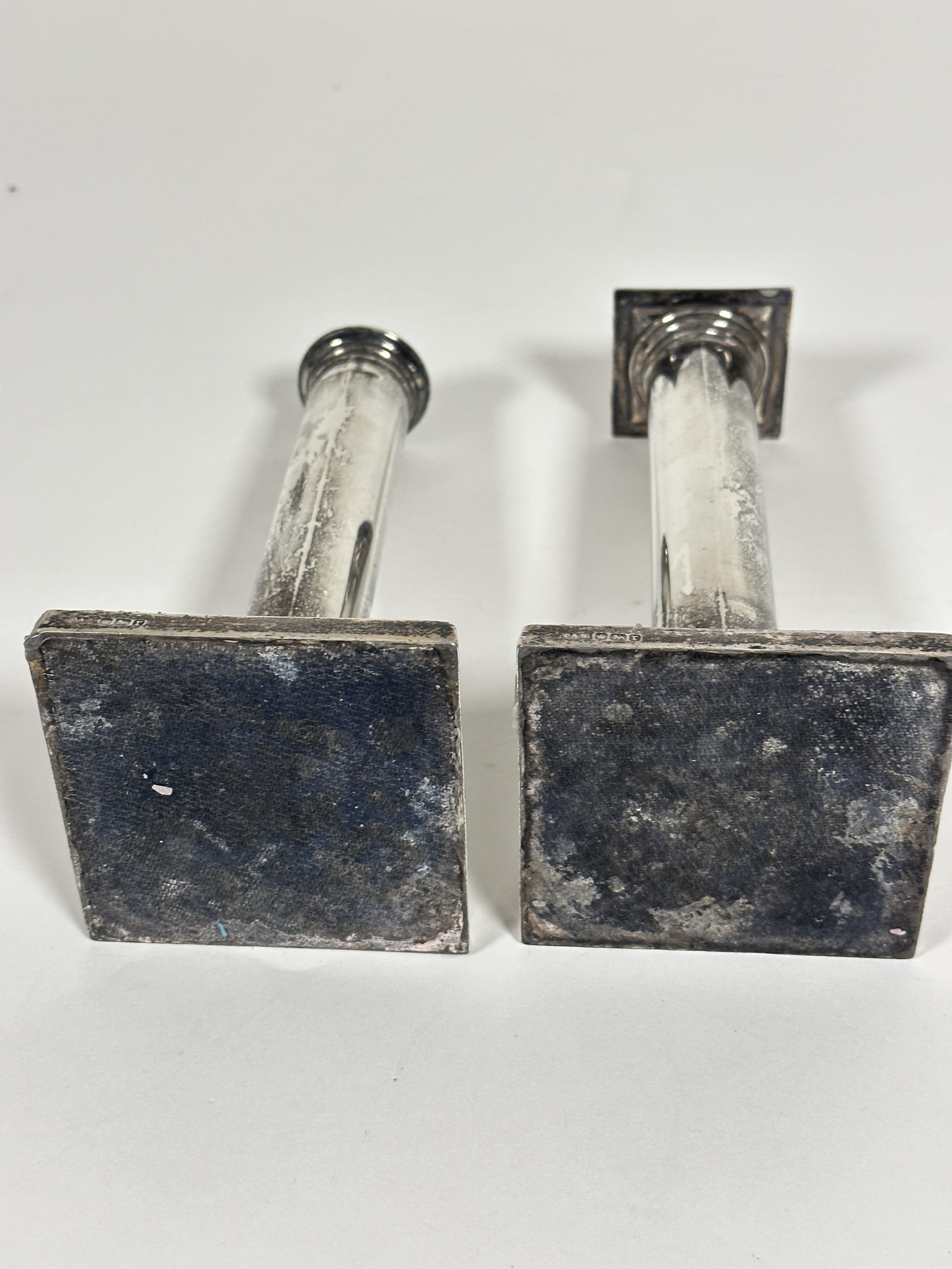 A pair of Edwardian Sheffield silver cast candlesticks of column form on stepped bases with reeded - Image 3 of 4