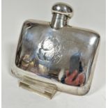 A Chester 1907 silver hip flask of curved shape with screw down top with engraved initials ES, (h