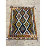 A Chobi kilim rug, of repeating lozenge design, 142cm x 102cm