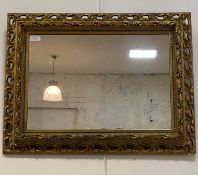 A floral moulded gilt framed wall mirror, 50cm x 66cm