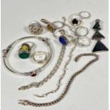 A white metal carnelian mounted stiff bangle, a collection of semi precious set white metal rings