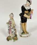 An 18thc porcelain figure of a lady with cap and overcoat, one arm missing, chips to robe, and to