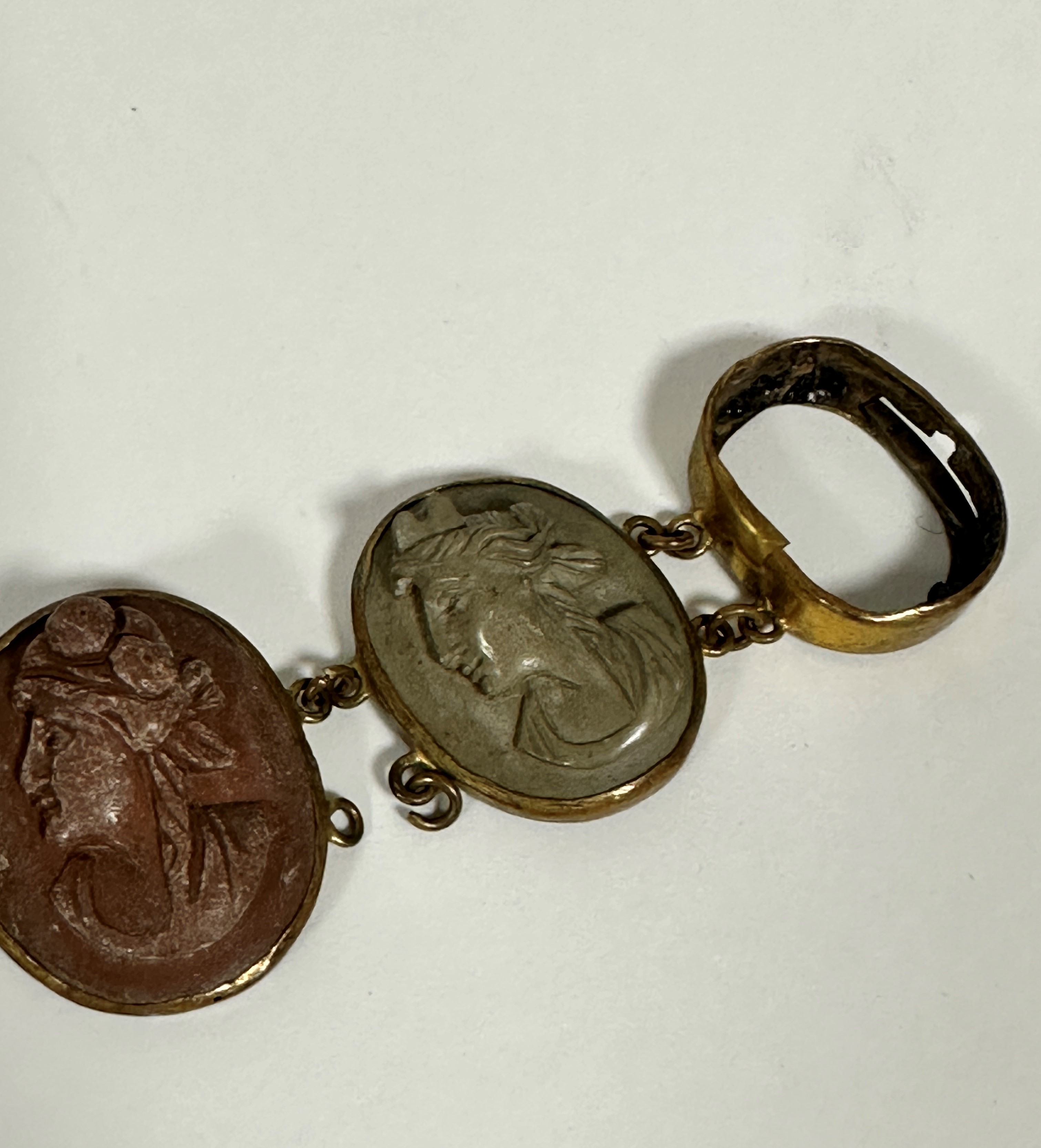A 19thc gilt metal mounted graduated oval lava cameo bracelet, one panel missing, damage to links - Image 5 of 5