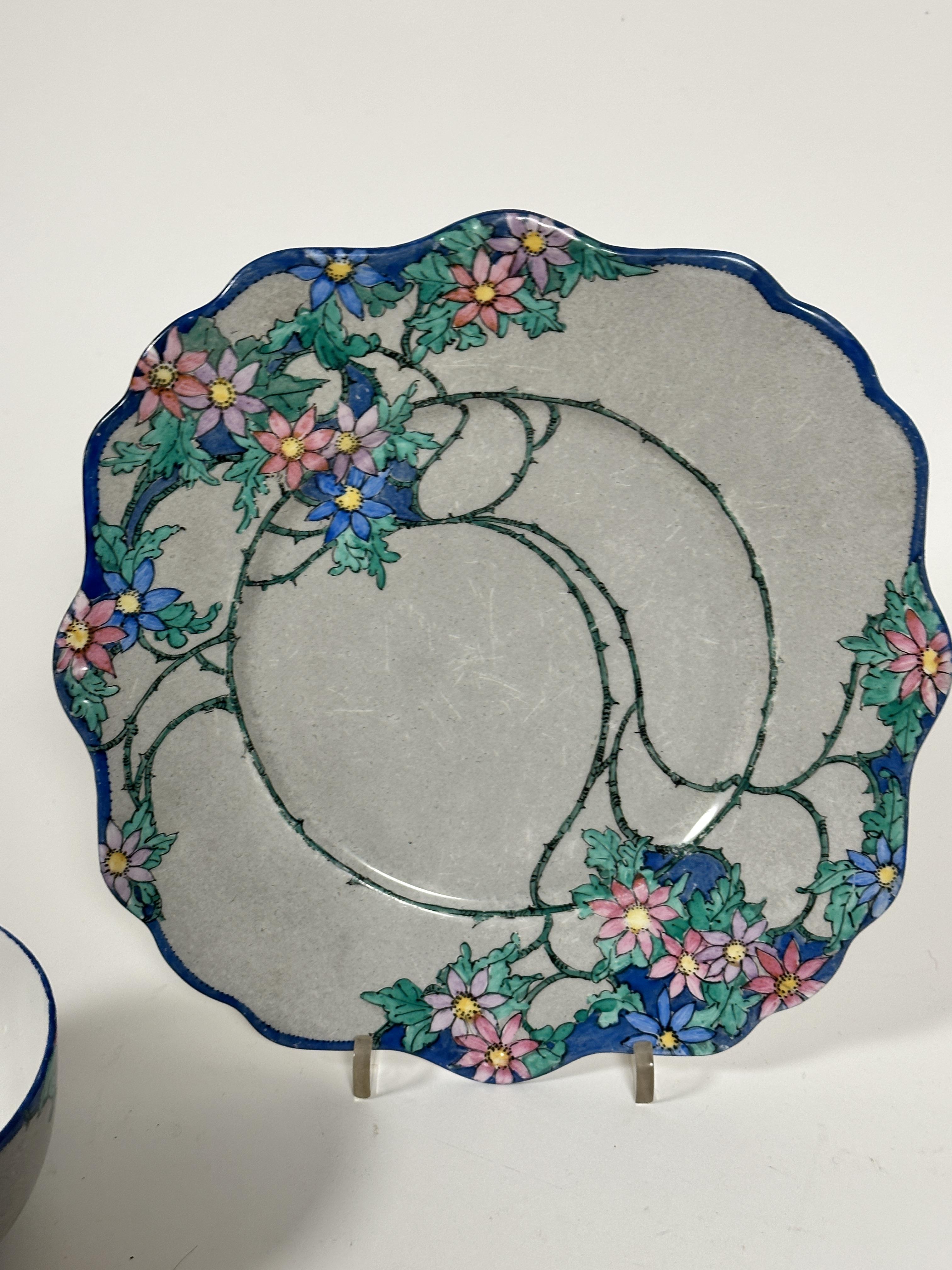 A fourteen piece 1920s tea set with handpainted floral scrolling leaf design with blue reserves - Image 2 of 4