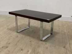 A 1970's rosewood veneered coffee table, the rectangular top raised on chrome supports, H42cm,