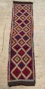 A Kilim runner rug, of all over geometric design, 286cm x 74cm