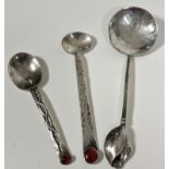 A Continental Georg Jensen style spoon, the square stem with twin leaf scrolling design inset with