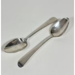 A pair of London 1819 silver old English pattern table spoons, not engraved, makers mark SA (L: