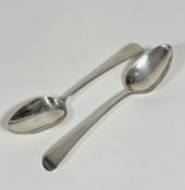 A pair of London 1819 silver old English pattern table spoons, not engraved, makers mark SA (L: